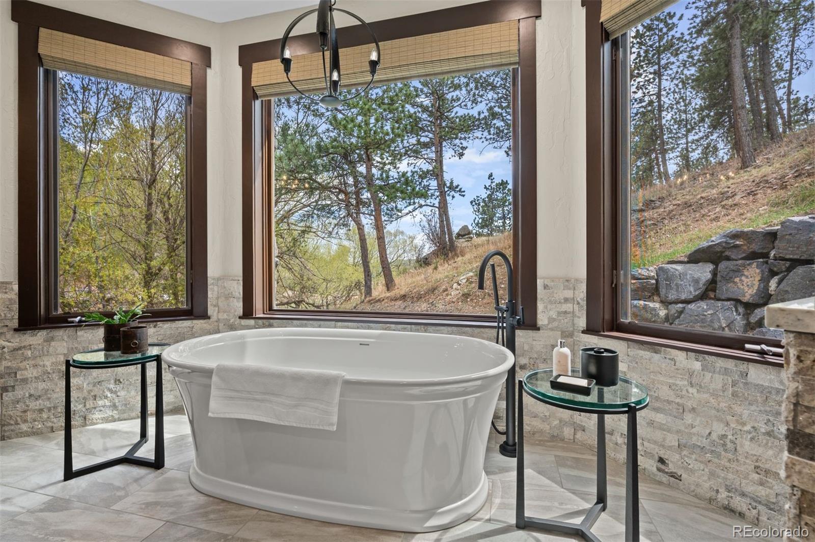 1733 Swede Gulch Road Evergreen, CO 80439 - Photo 28 of 50 a bath tub sitting next to a window