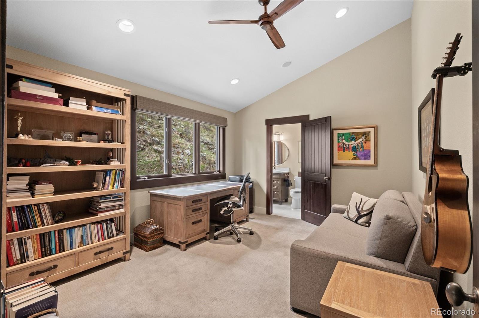 1733 Swede Gulch Road Evergreen, CO 80439 - Photo 30 of 50 a living room with furniture cabinets and window