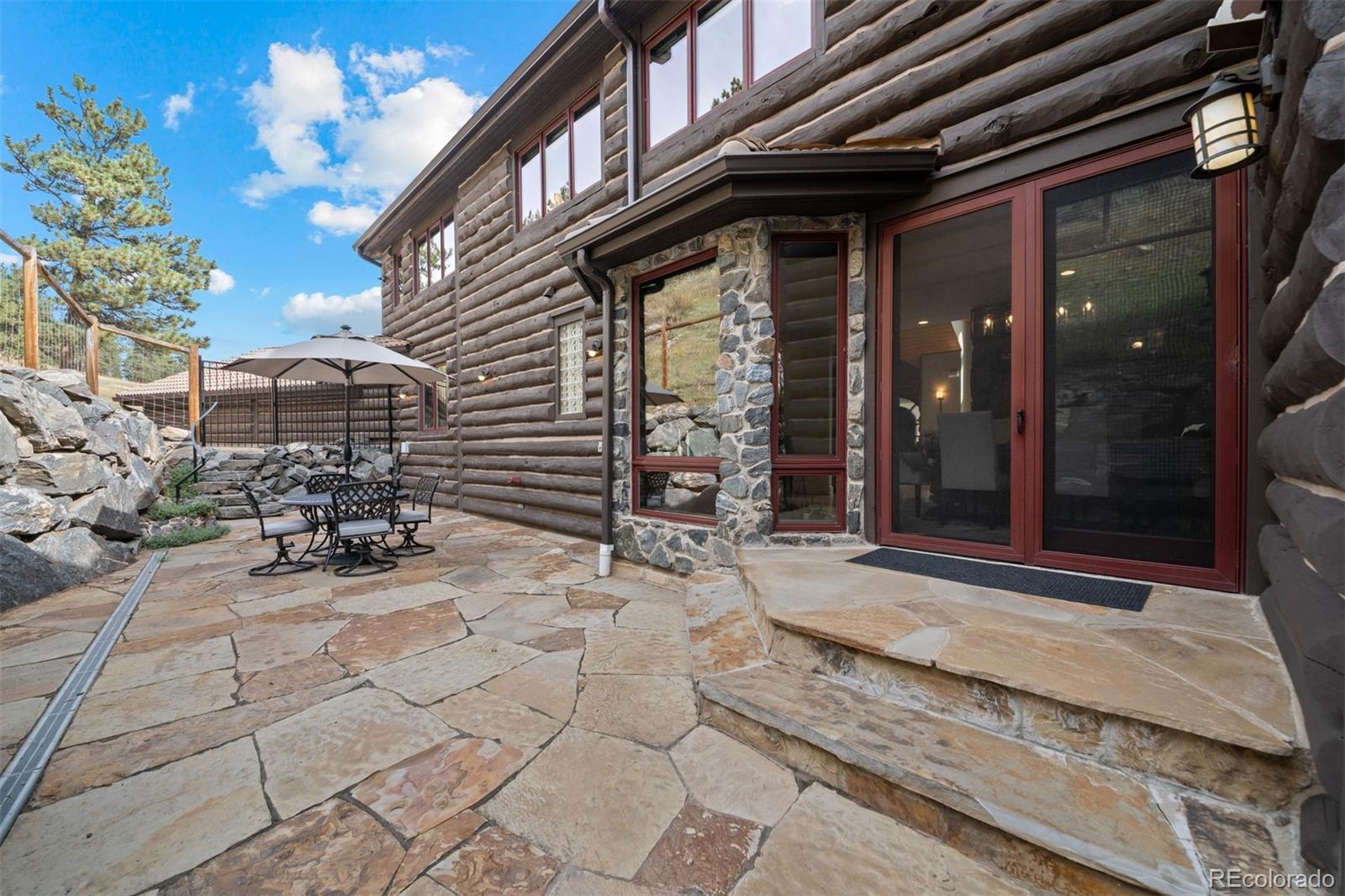 1733 Swede Gulch Road Evergreen, CO 80439 - Photo 46 of 50 a view of backyard with wheel chair and potted plants