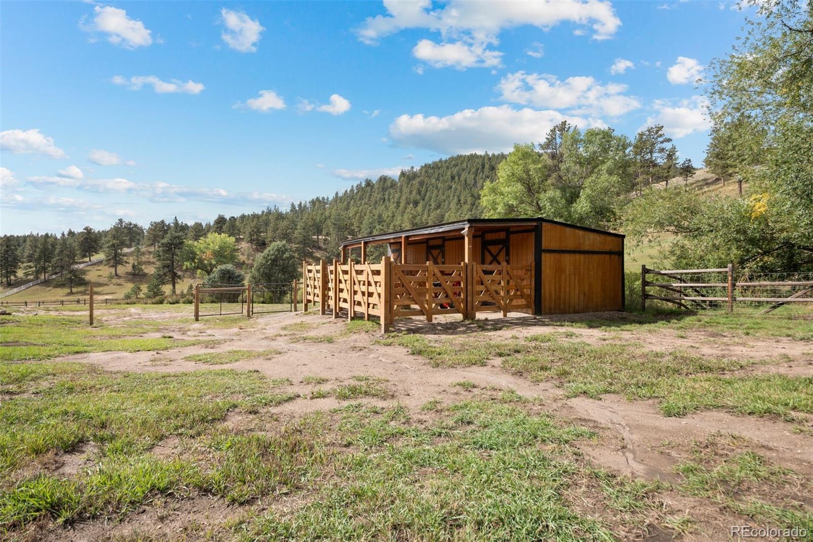 1733 Swede Gulch Road Evergreen, CO 80439 - Photo 49 of 50 a view of a house with a yard