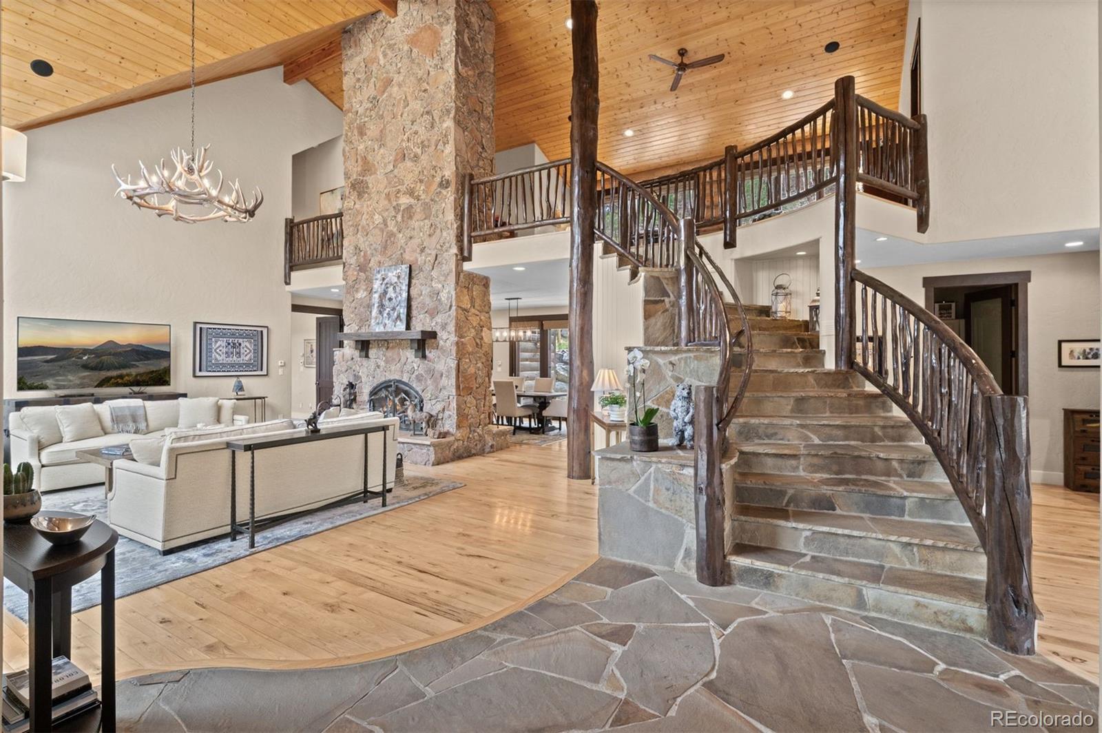 1733 Swede Gulch Road Evergreen, CO 80439 - Photo 10 of 50 a view of entryway and hall with wooden floor