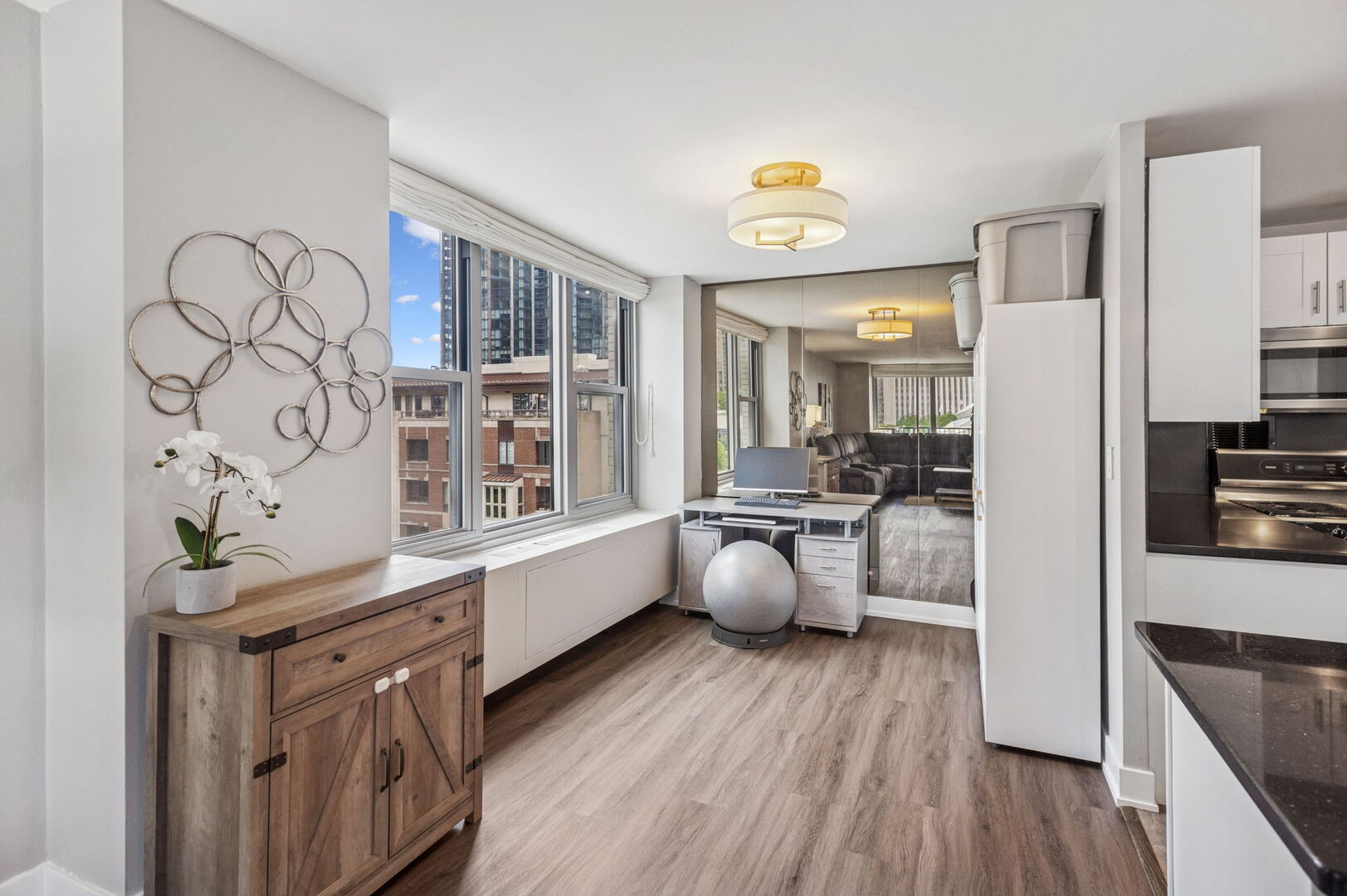 400 East Randolph Street, Unit 930 Chicago, IL 60601 - Photo 9 of 34 a kitchen with stainless steel appliances a stove a sink a refrigerator and wooden floor