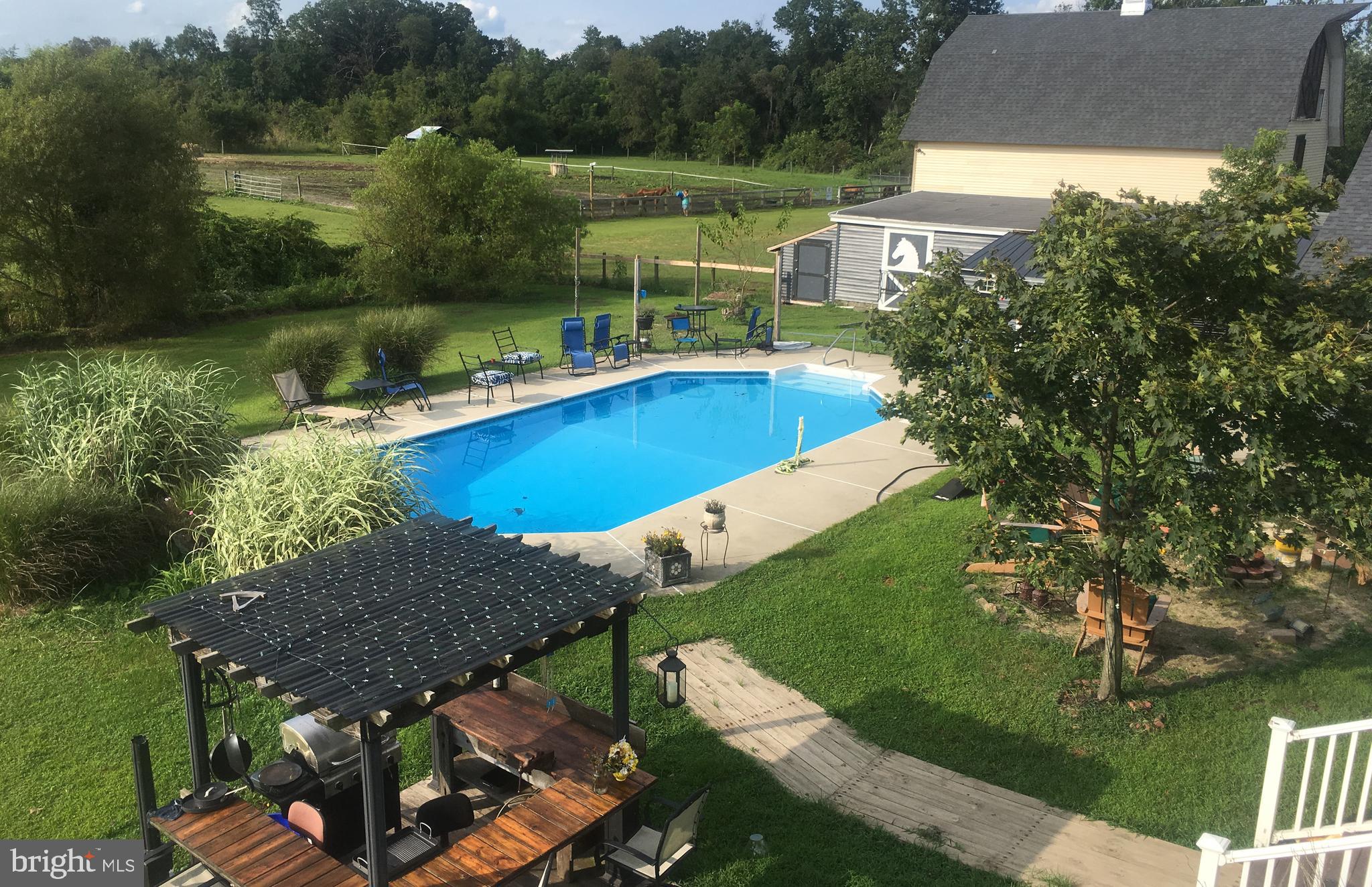 174 West Tomlin Station Road Mickleton, NJ 08056 - Photo 13 of 41 an aerial view of a house with swimming pool outdoor seating and yard