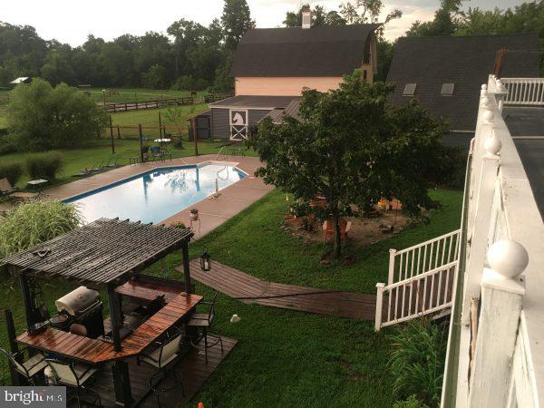 174 West Tomlin Station Road Mickleton, NJ 08056 - Photo 16 of 41 a view of a swimming pool with a patio and a garden