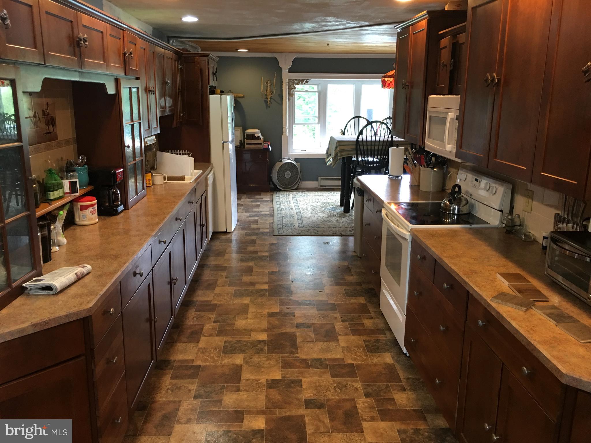 174 West Tomlin Station Road Mickleton, NJ 08056 - Photo 5 of 41 a kitchen with sink stove and cabinets