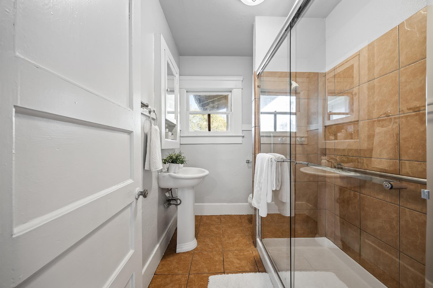 4001 East Balch Avenue Fresno, CA 93702 - Photo 11 of 22 a bathroom with a sink and a shower
