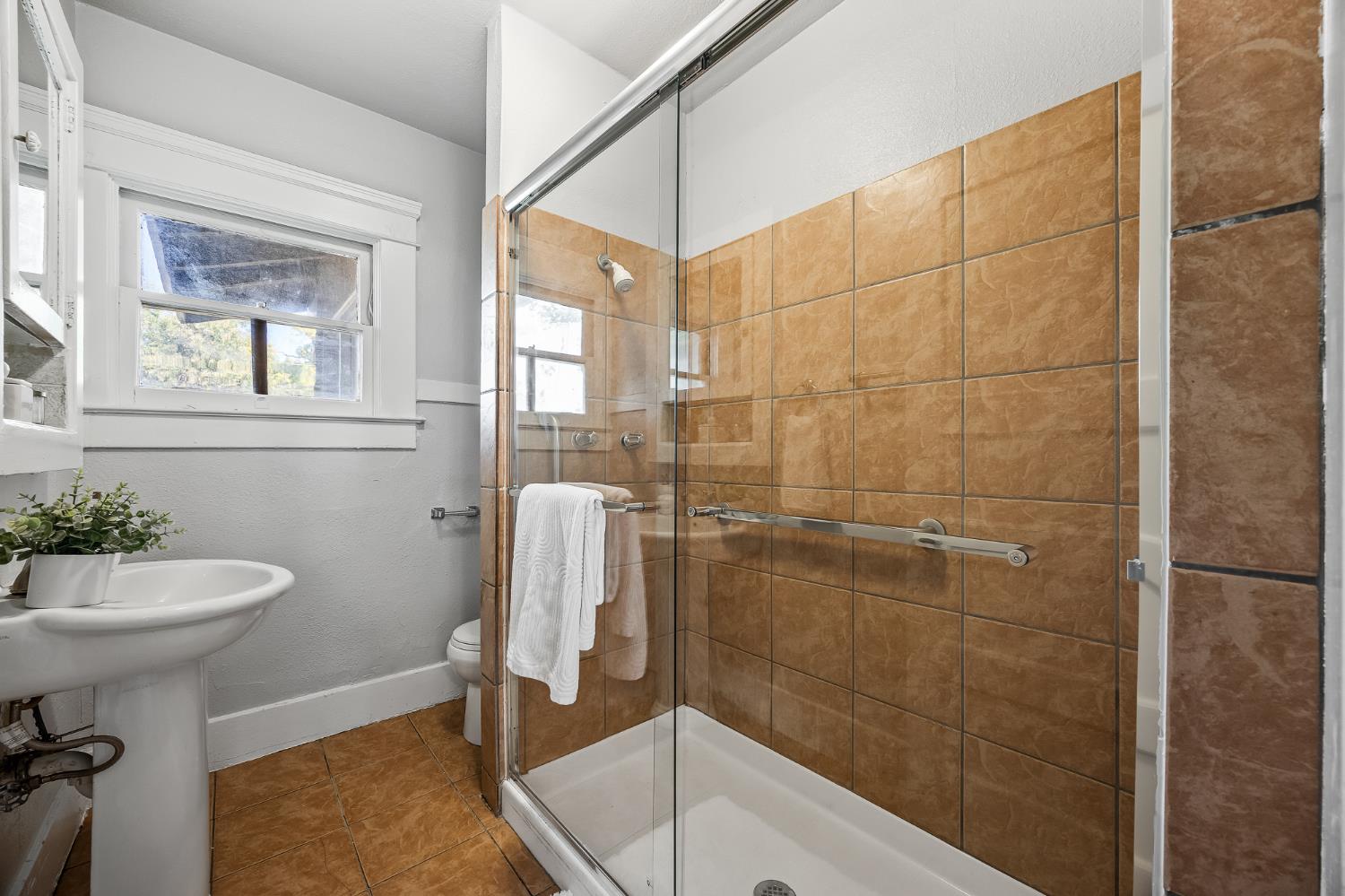 4001 East Balch Avenue Fresno, CA 93702 - Photo 12 of 22 a bathroom with a sink and toilet