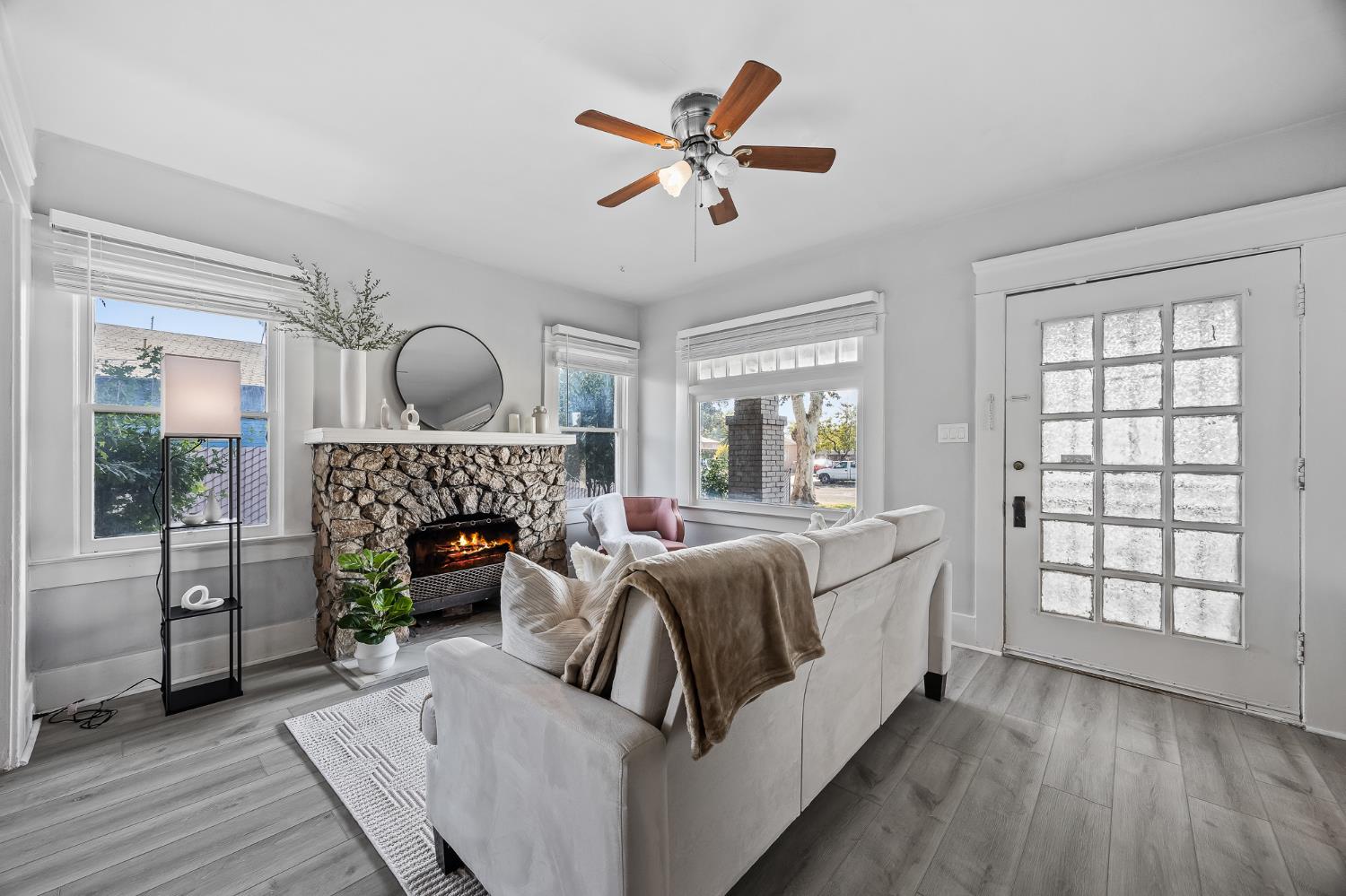 4001 East Balch Avenue Fresno, CA 93702 - Photo 3 of 22 a living room with furniture and a fireplace