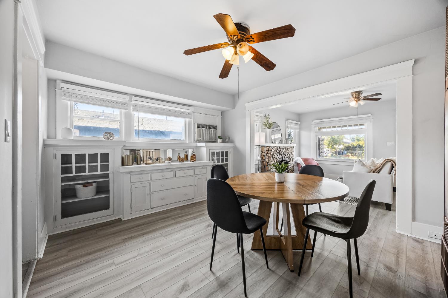 4001 East Balch Avenue Fresno, CA 93702 - Photo 6 of 22 a kitchen with a dining table chairs stainless steel appliances and cabinets