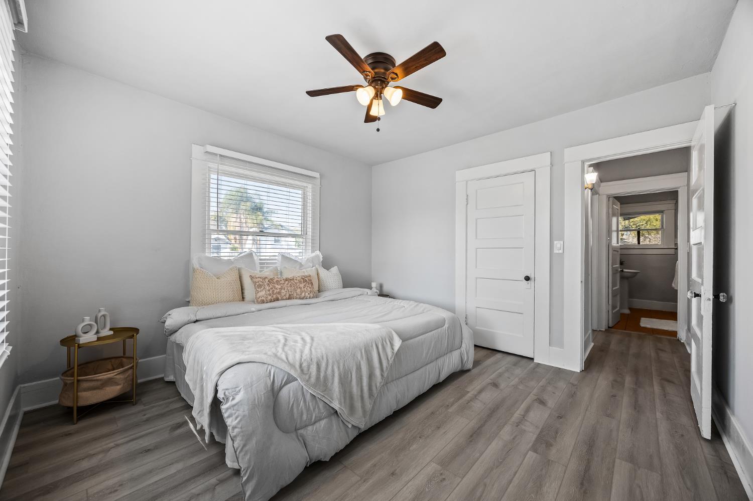 4001 East Balch Avenue Fresno, CA 93702 - Photo 10 of 22 a bedroom with a bed and a ceiling fan