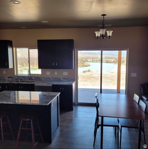 9381 South Sevier Riv Ranch Levan, UT 84639 - Photo 13 of 58 Kitchen with dark wood-finish flooring, dark cabinetry, and light-toned countertops