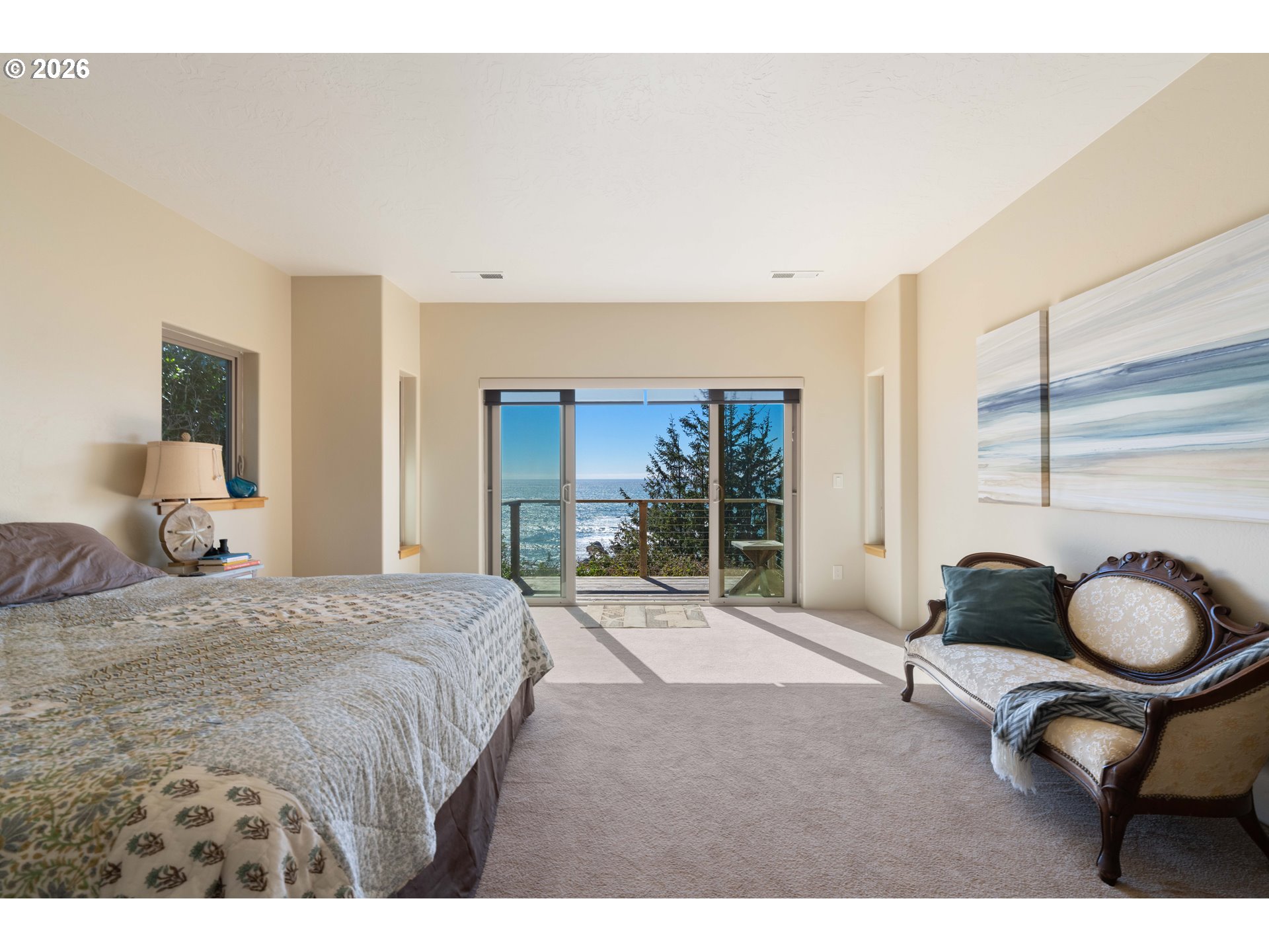 201 Allen Lane Brookings, OR 97415 - Photo 27 of 29 a bedroom with a bed and large windows