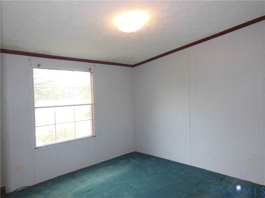 5018 Olgers Road Sutherland, VA 23885 - Photo 23 of 26 an empty room with a window