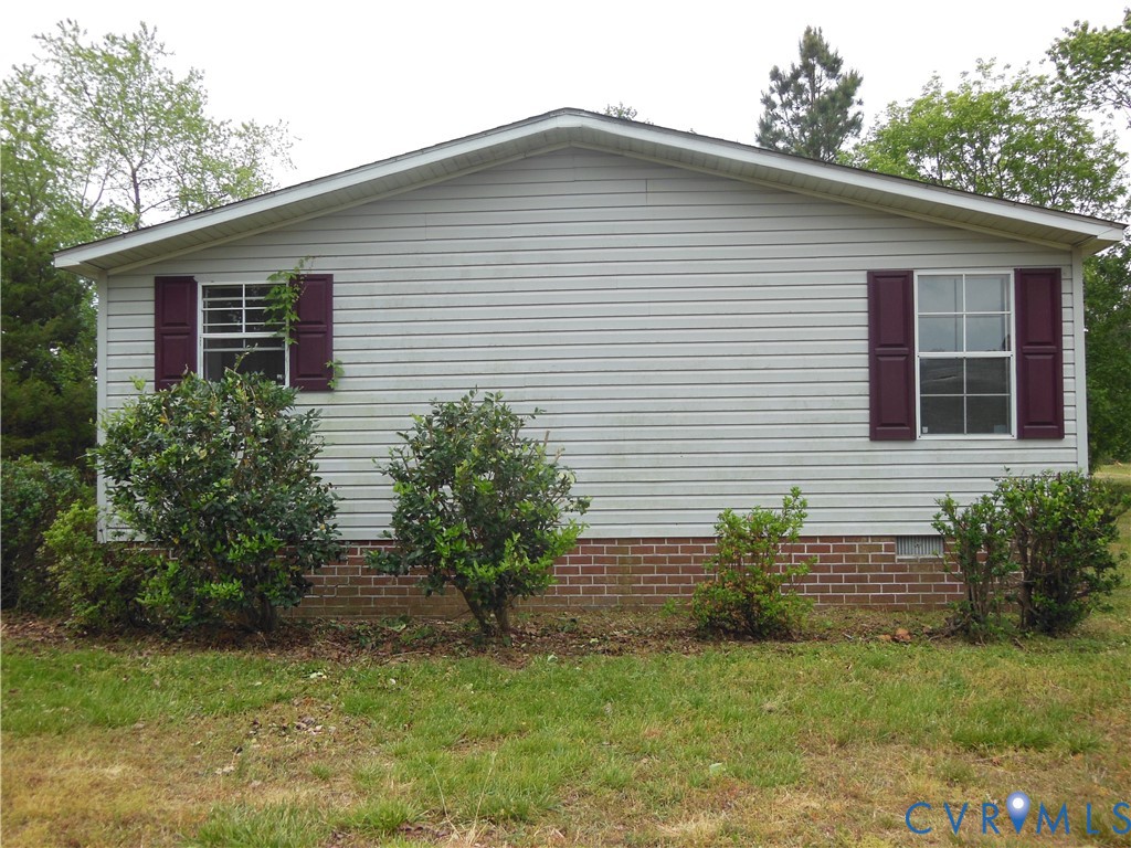 5018 Olgers Road Sutherland, VA 23885 - Photo 3 of 26 a view of a house with a yard