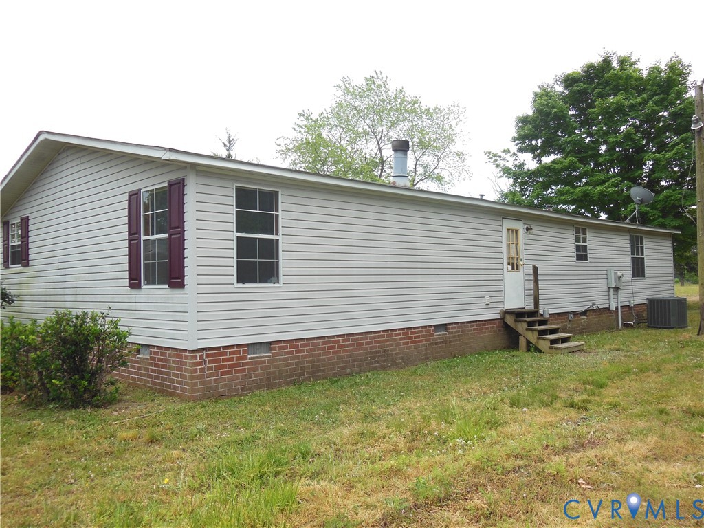 5018 Olgers Road Sutherland, VA 23885 - Photo 4 of 26 a backyard of a house with seating space