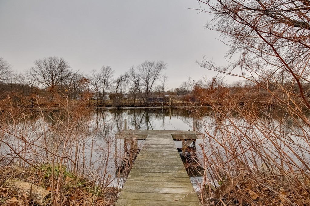 a lake view with wooden bridge and lake view