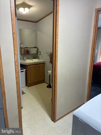 a room with a sink and a mirror