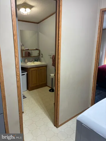 a room with a sink and a mirror