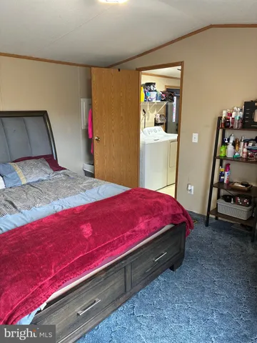 a bed room with a bed and a window