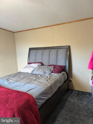 a bedroom with a bed and closet