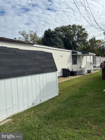 a view of a backyard with sitting area