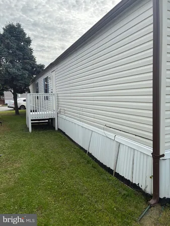 a view of a backyard with sitting area