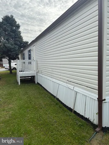 a view of a backyard with sitting area