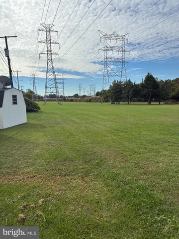 a view of a field with ocean view