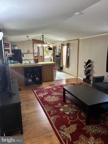 a living room with a couch and dresser