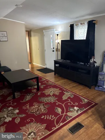 a living room with a couch and a flat screen tv