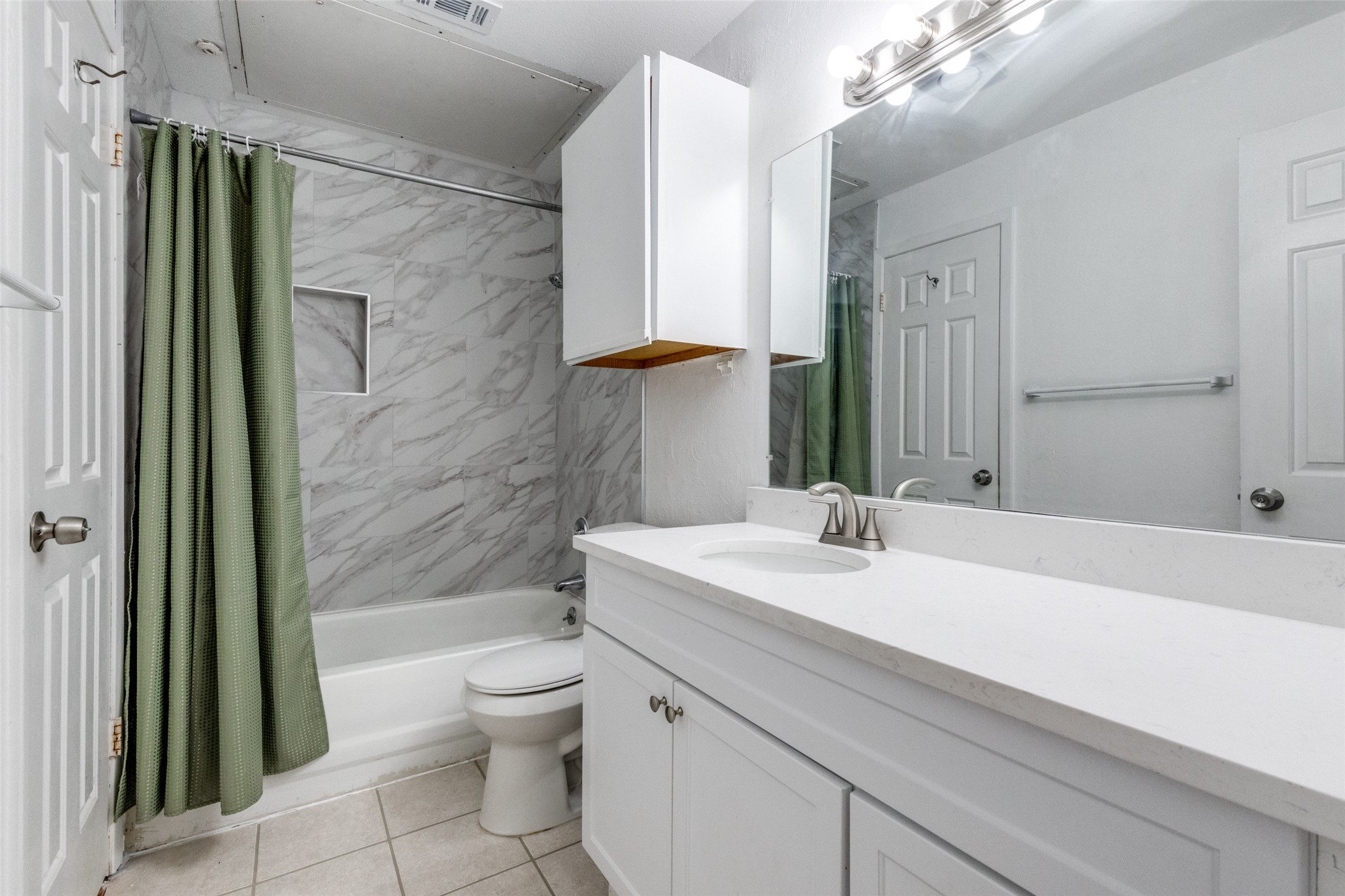 807 West 25th Street, Unit 214 Austin, TX 78705 - Photo 18 of 26 a bathroom with a sink a toilet and shower