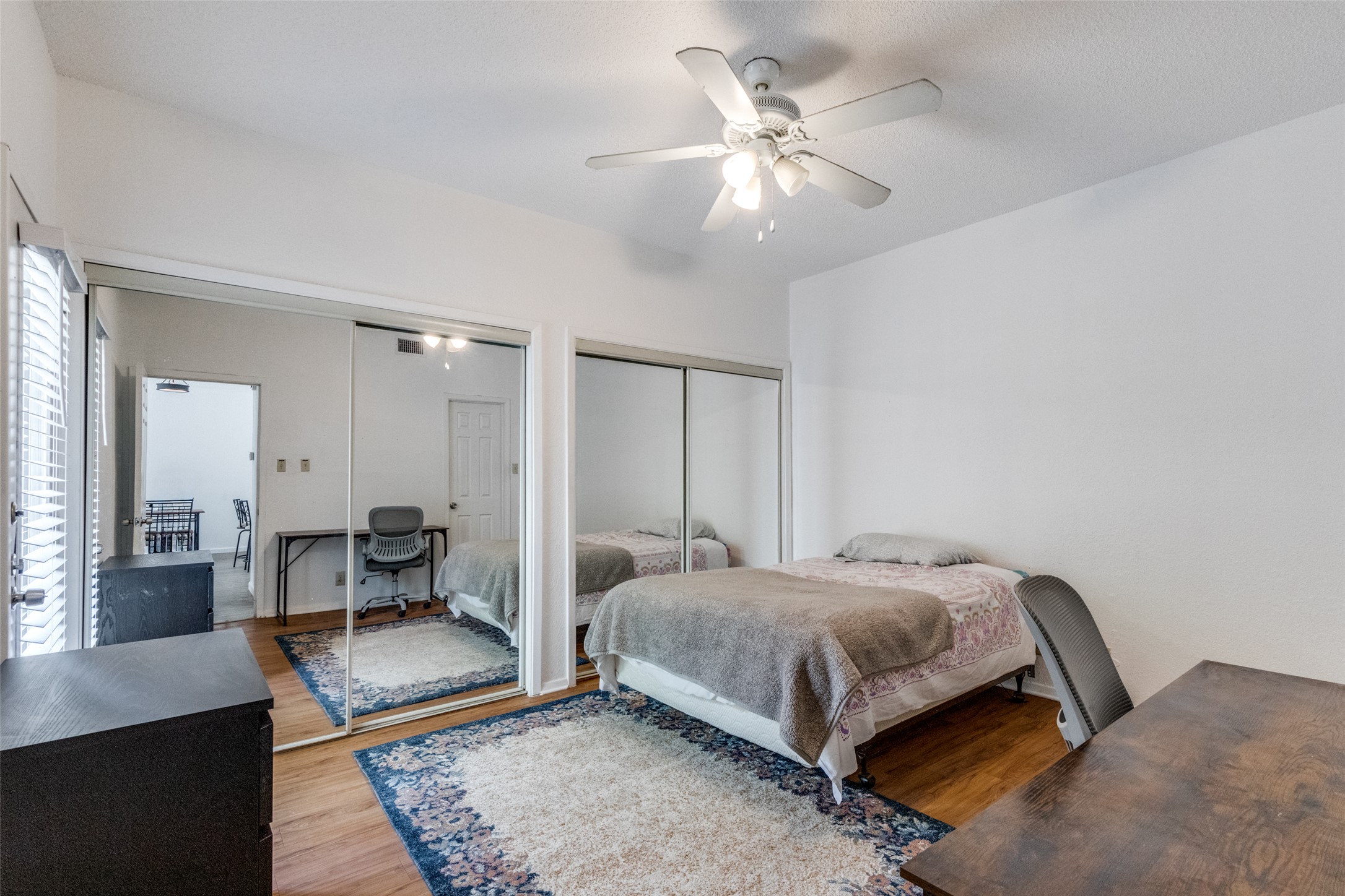 807 West 25th Street, Unit 214 Austin, TX 78705 - Photo 23 of 26 a bedroom with a bed and a chandelier