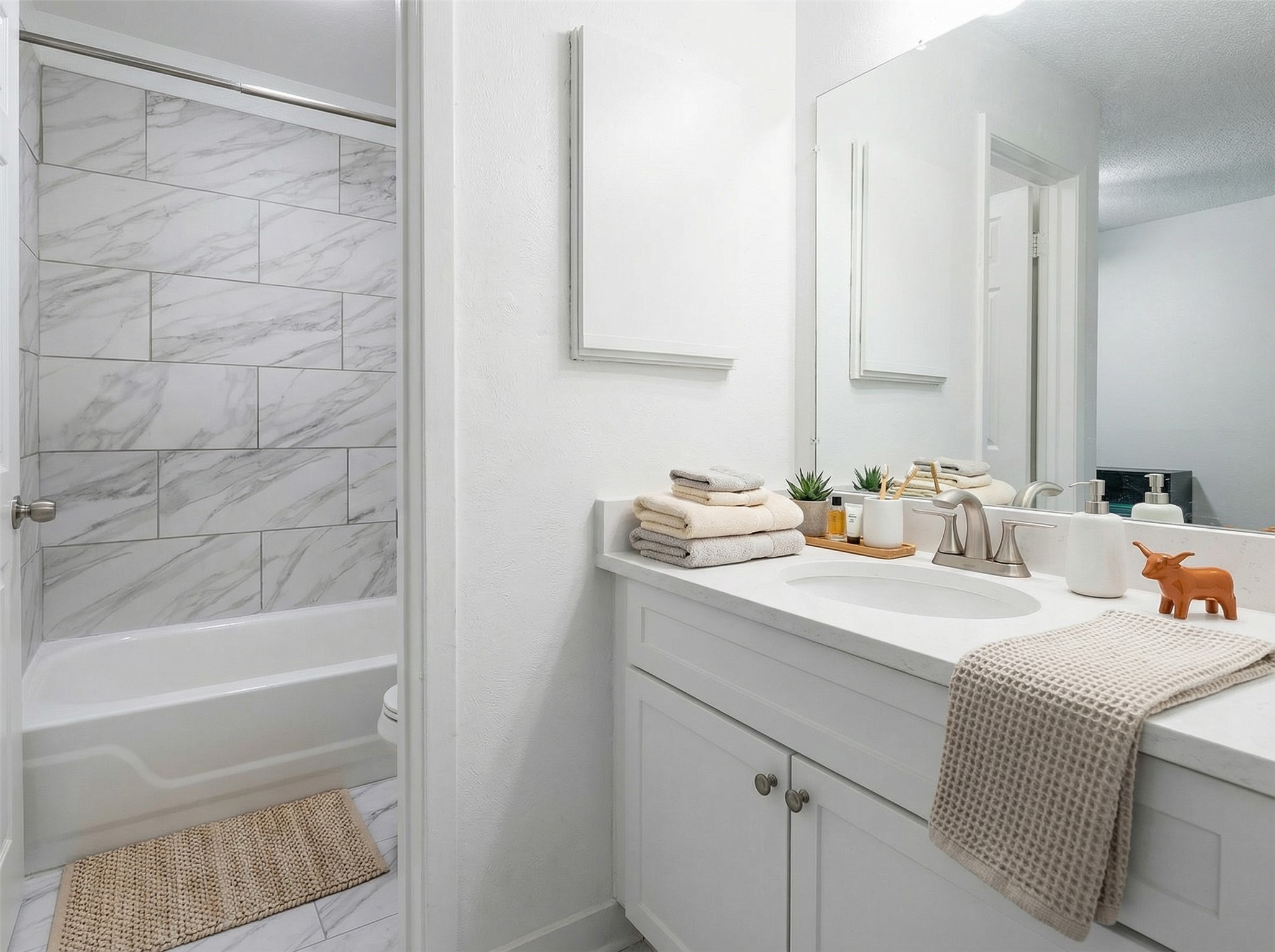 807 West 25th Street, Unit 214 Austin, TX 78705 - Photo 8 of 26 a bathroom with a sink and a mirror