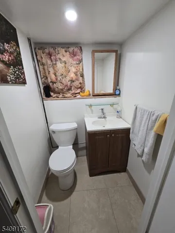 a view of a patio with lawn chairs