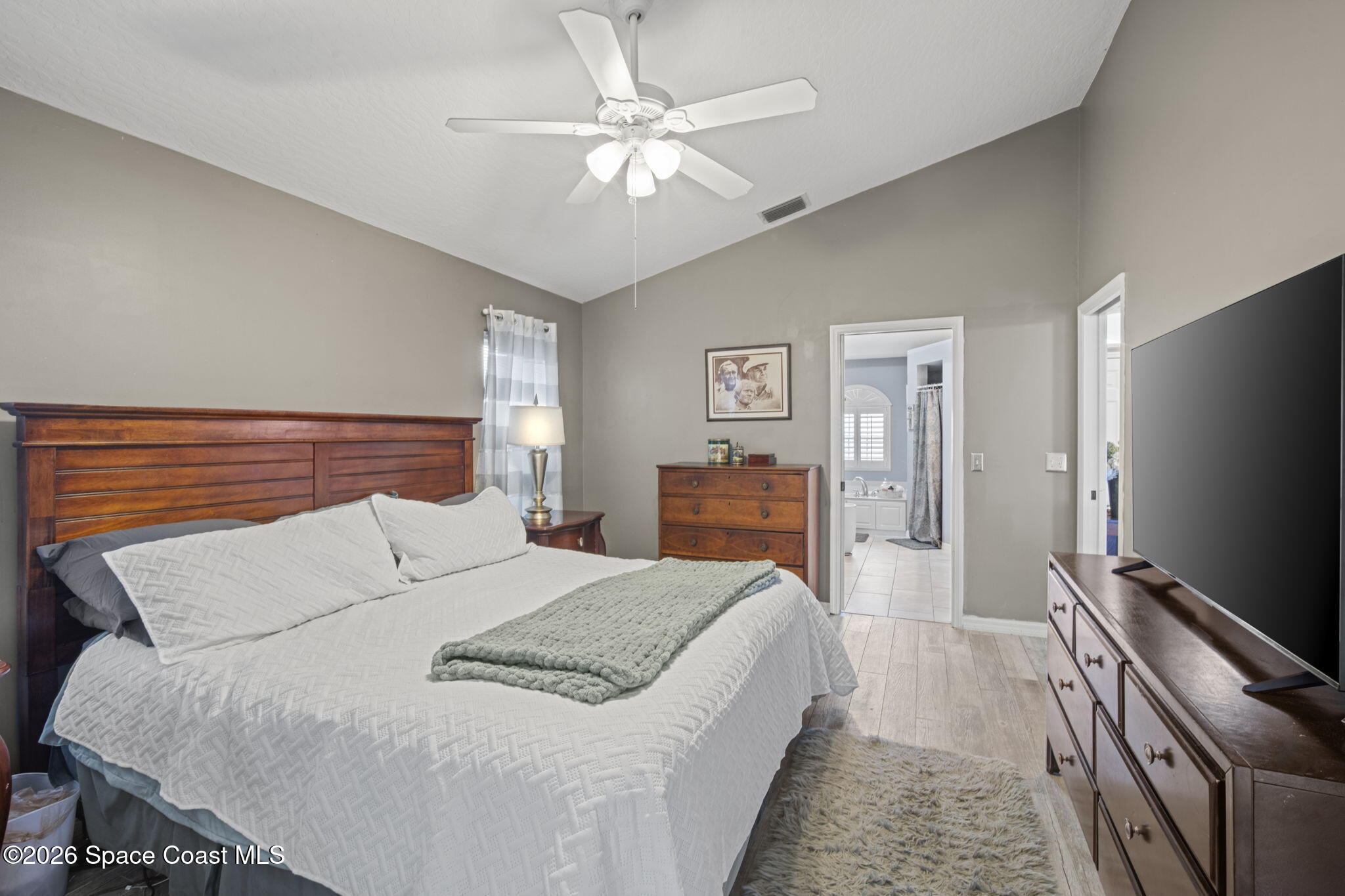 472 Arbor Street Sebastian, FL 32958 - Photo 12 of 33 a bed room with a bed and a television