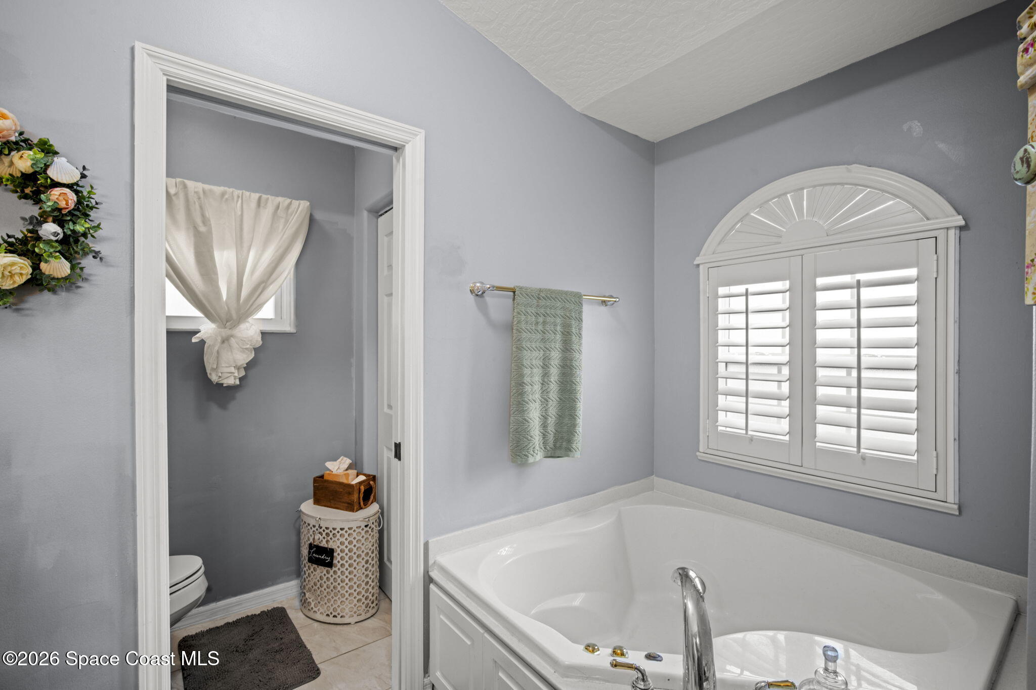 472 Arbor Street Sebastian, FL 32958 - Photo 17 of 33 a bathroom with a tub toilet and a sink