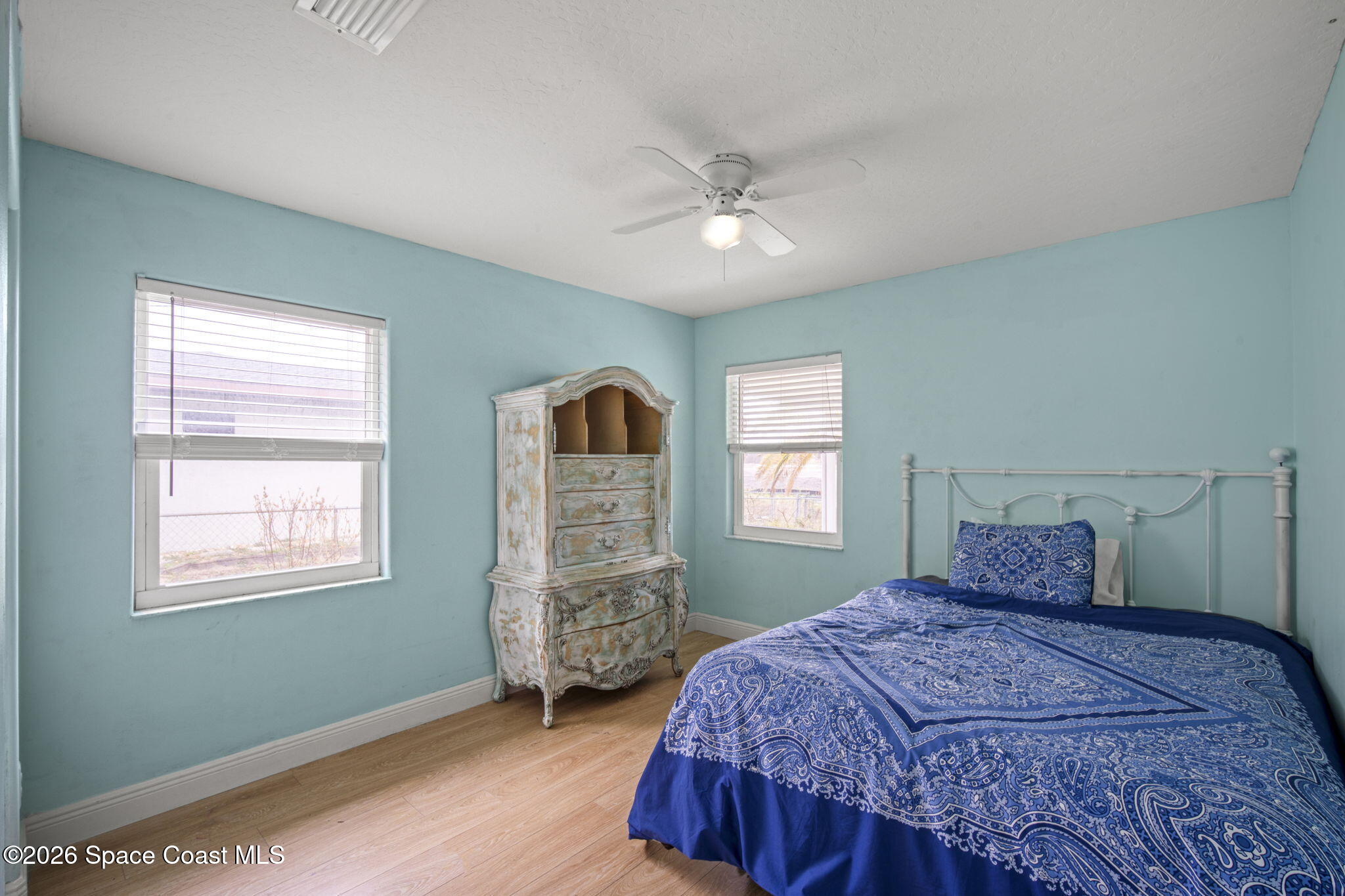 472 Arbor Street Sebastian, FL 32958 - Photo 18 of 33 a bedroom with a bed and a window