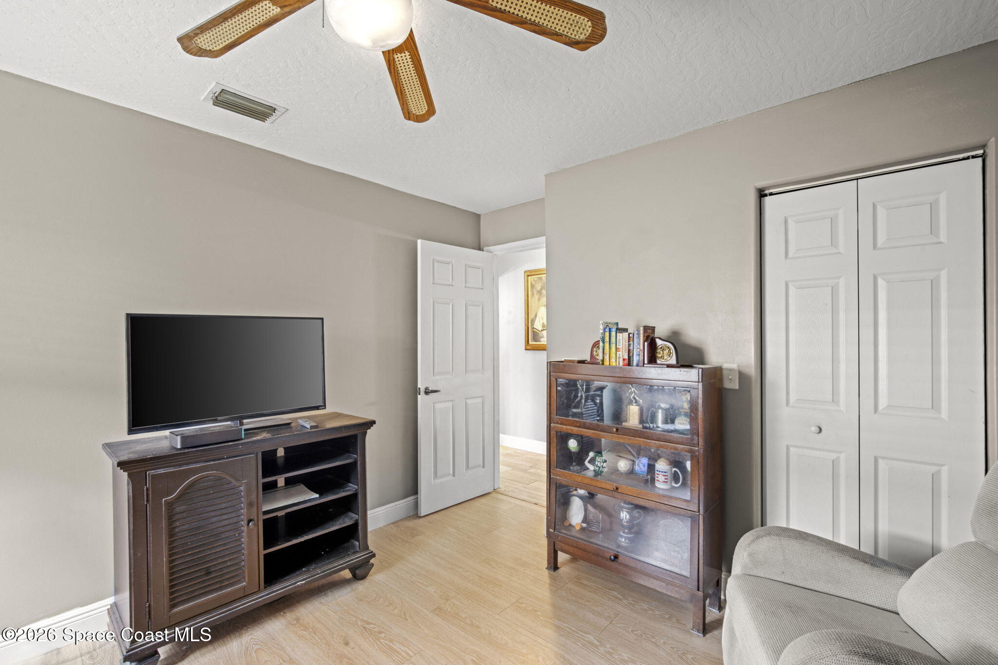 472 Arbor Street Sebastian, FL 32958 - Photo 21 of 33 a view of a livingroom with furniture and a flat screen tv