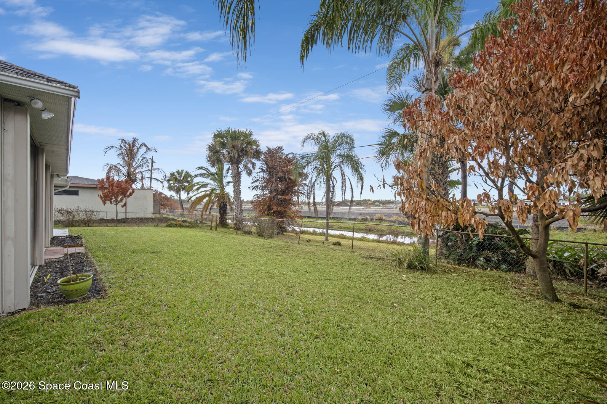 472 Arbor Street Sebastian, FL 32958 - Photo 29 of 33 a backyard of a house with table and chairs
