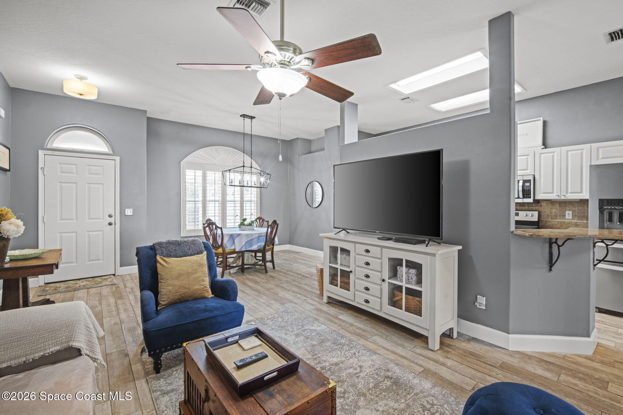 472 Arbor Street Sebastian, FL 32958 - Photo 3 of 33 a living room with furniture and a flat screen tv
