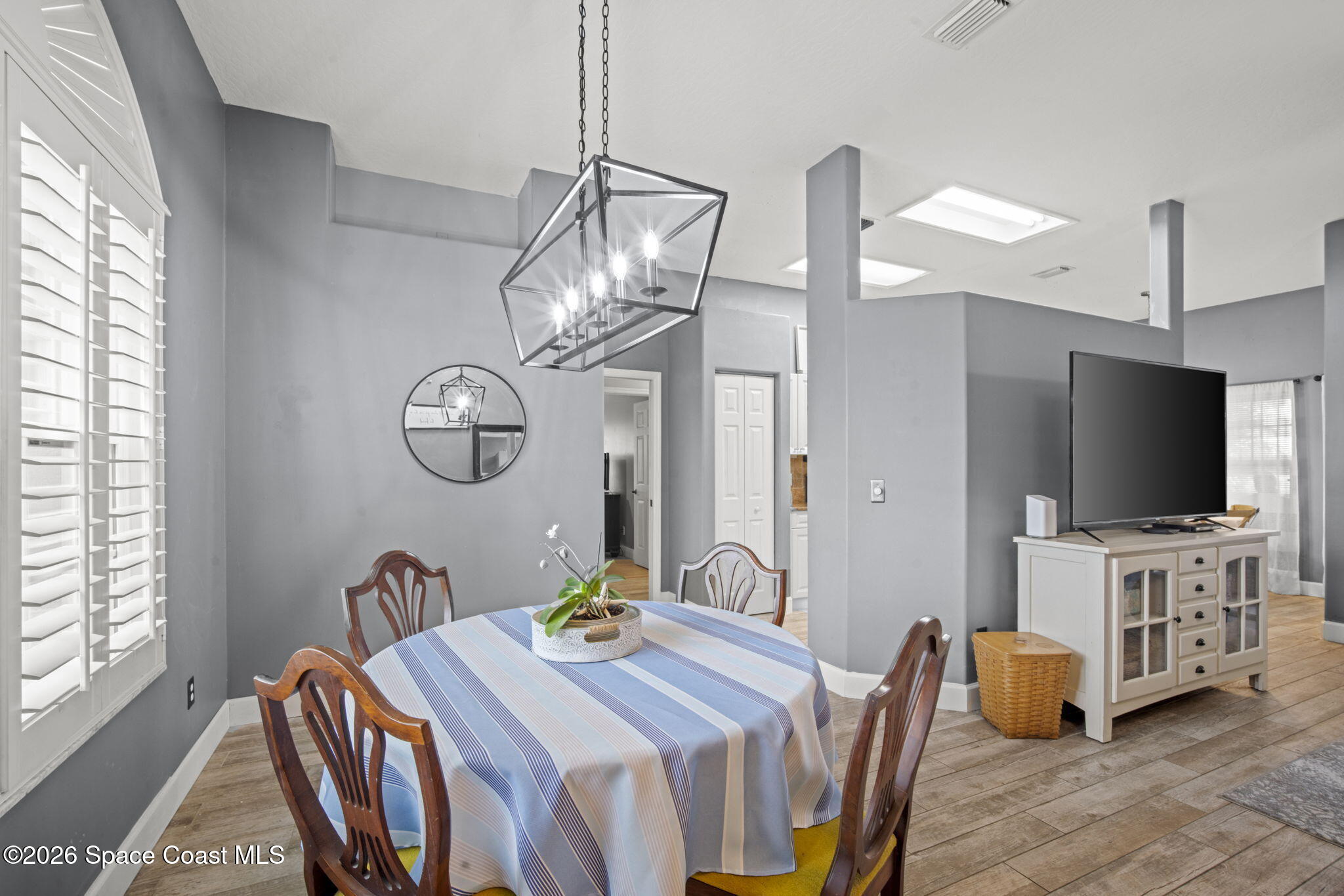 472 Arbor Street Sebastian, FL 32958 - Photo 6 of 33 a view of a dining room with furniture and a chandelier