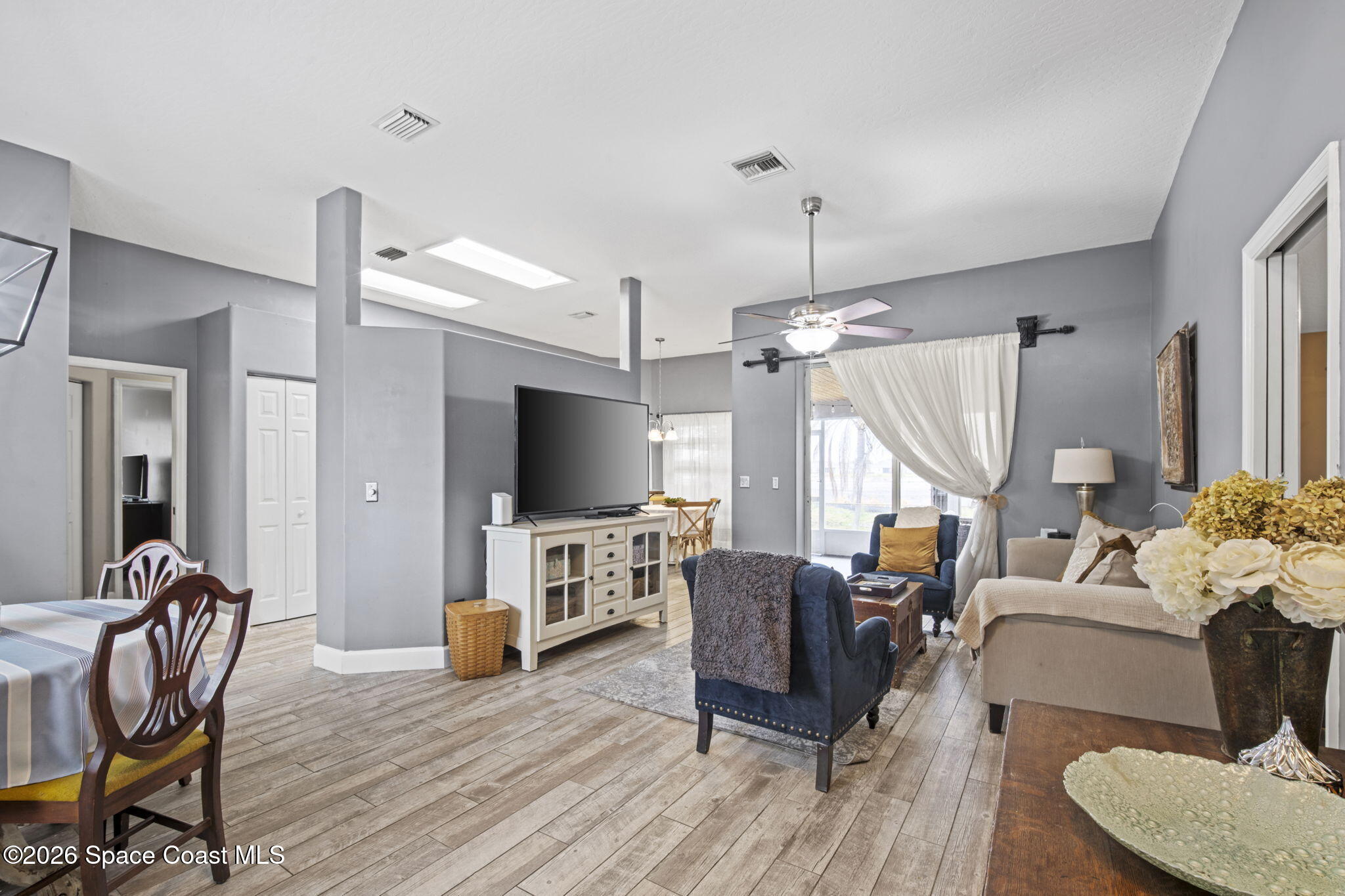 472 Arbor Street Sebastian, FL 32958 - Photo 7 of 33 a living room with furniture and a flat screen tv