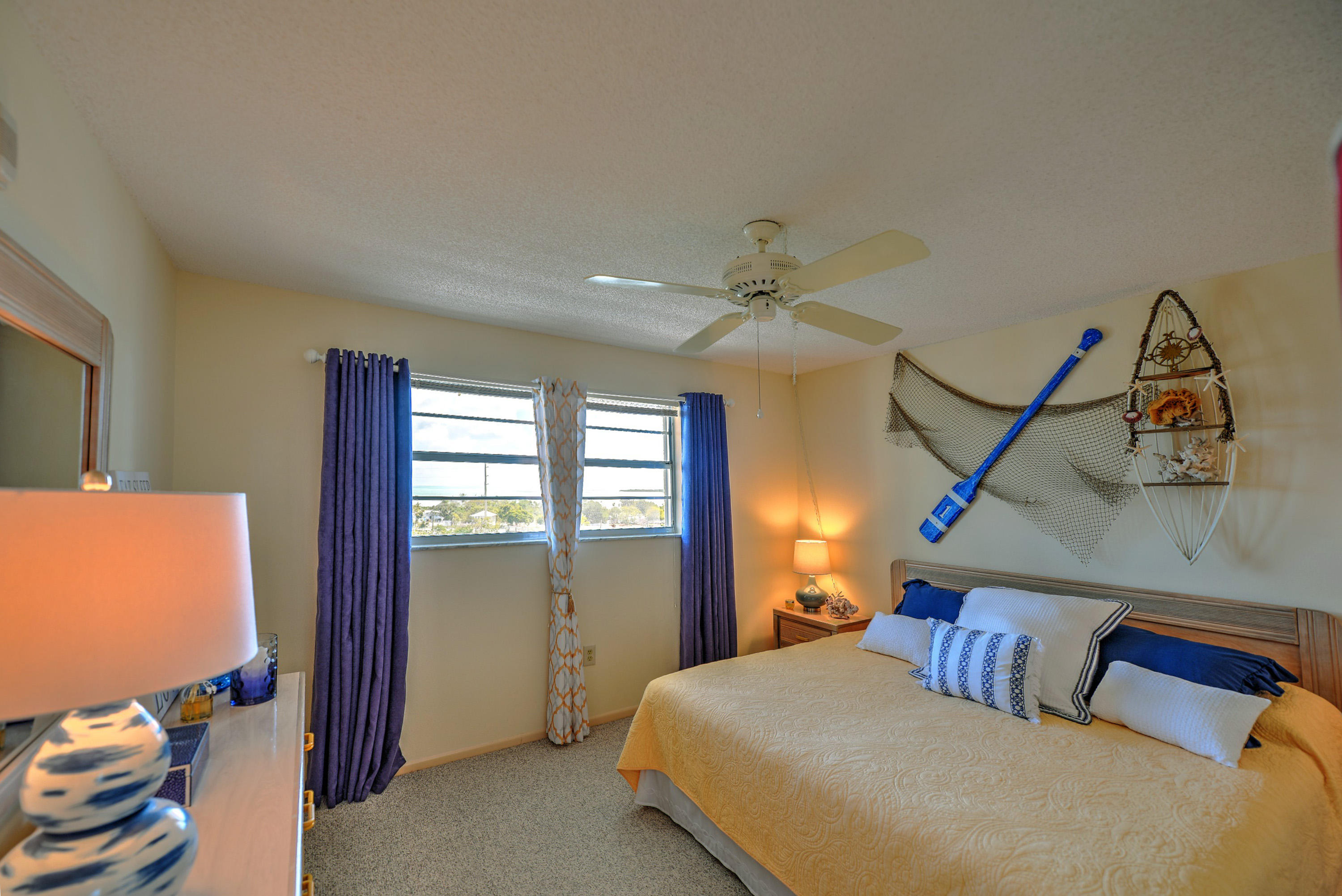 200 Harborview Drive, Unit PH 4 Tavernier, FL 33070 - Photo 15 of 33 a bedroom with a bed and a flat screen tv