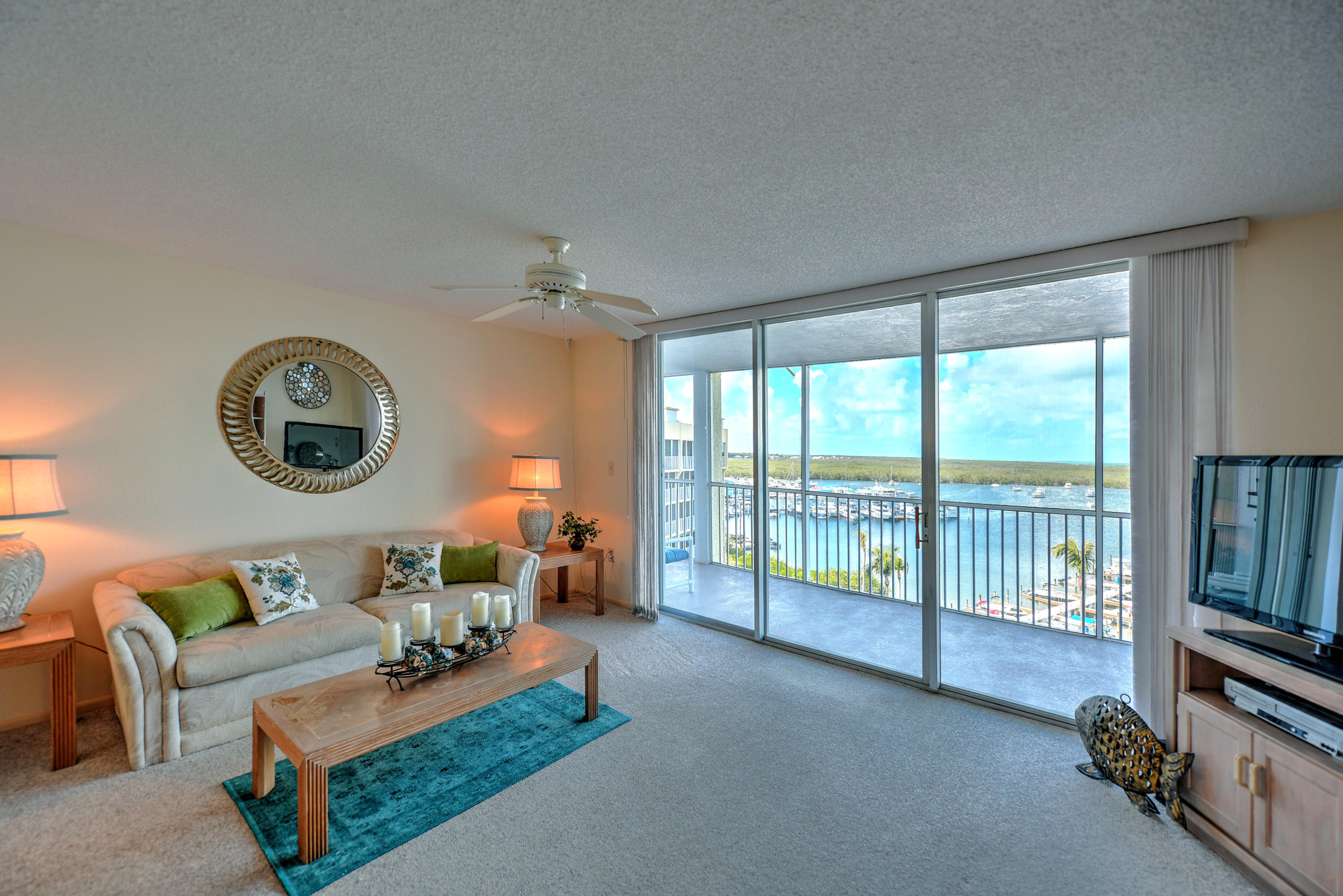 200 Harborview Drive, Unit PH 4 Tavernier, FL 33070 - Photo 6 of 33 a living room with furniture and a large window