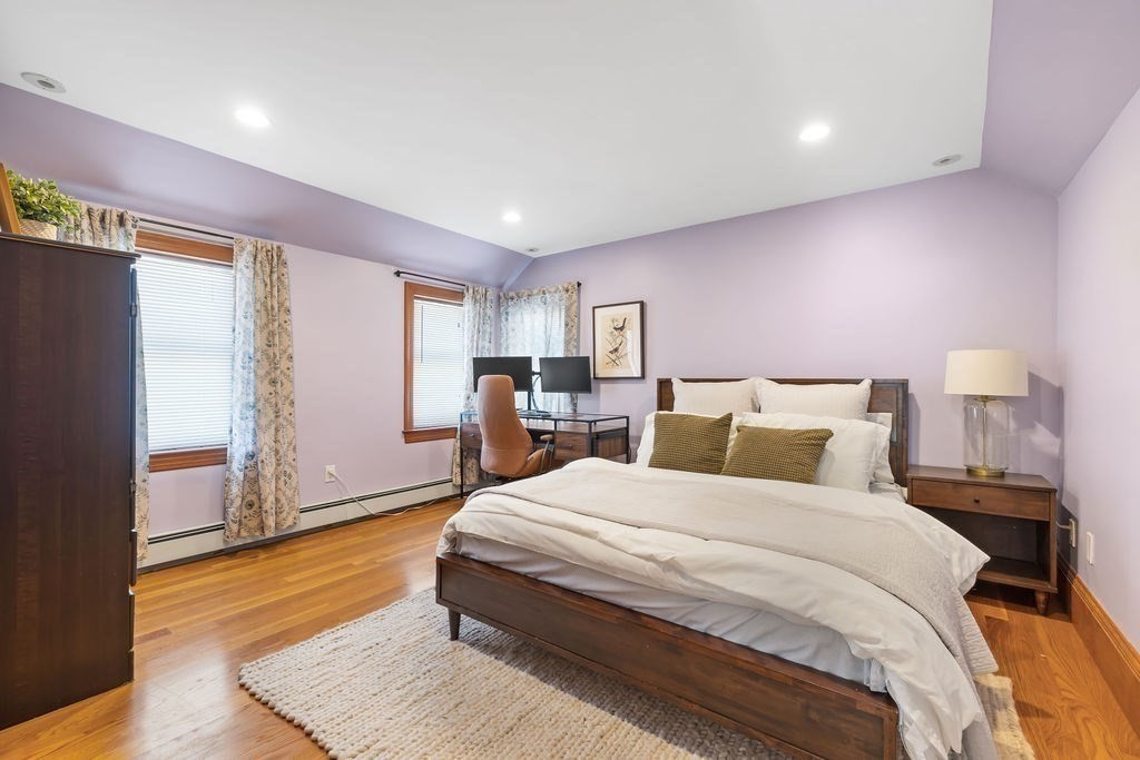 200 Washington Street Boston, MA 02135 - Photo 11 of 27 a spacious bedroom with a bed and a window