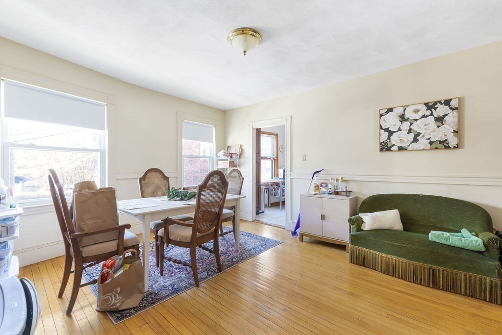 200 Washington Street Boston, MA 02135 - Photo 16 of 27 a living room with furniture and wooden floor