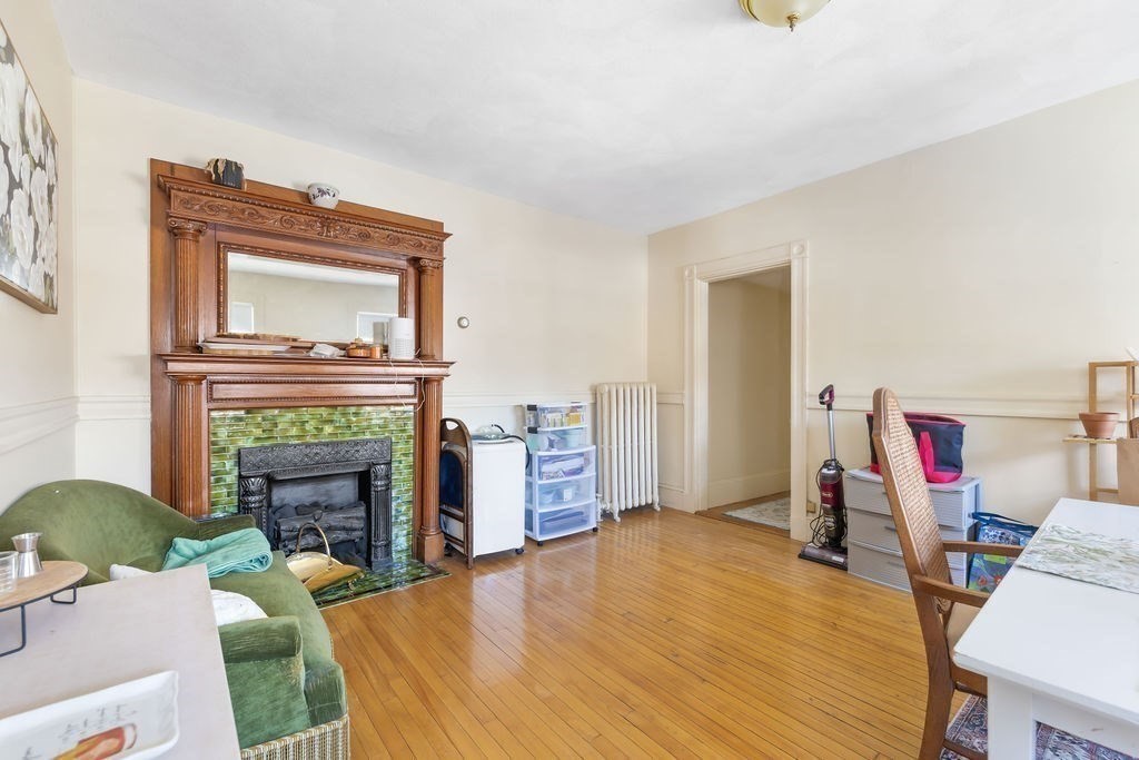 200 Washington Street Boston, MA 02135 - Photo 19 of 27 a living room with furniture and a fireplace