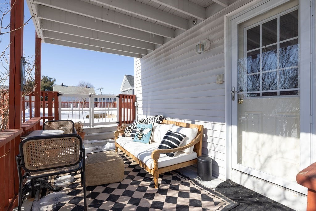 200 Washington Street Boston, MA 02135 - Photo 24 of 27 a balcony with furniture and a potted plant