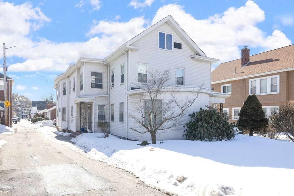 200 Washington Street Boston, MA 02135 - Photo 25 of 27 a view of a house with a yard covered in snow