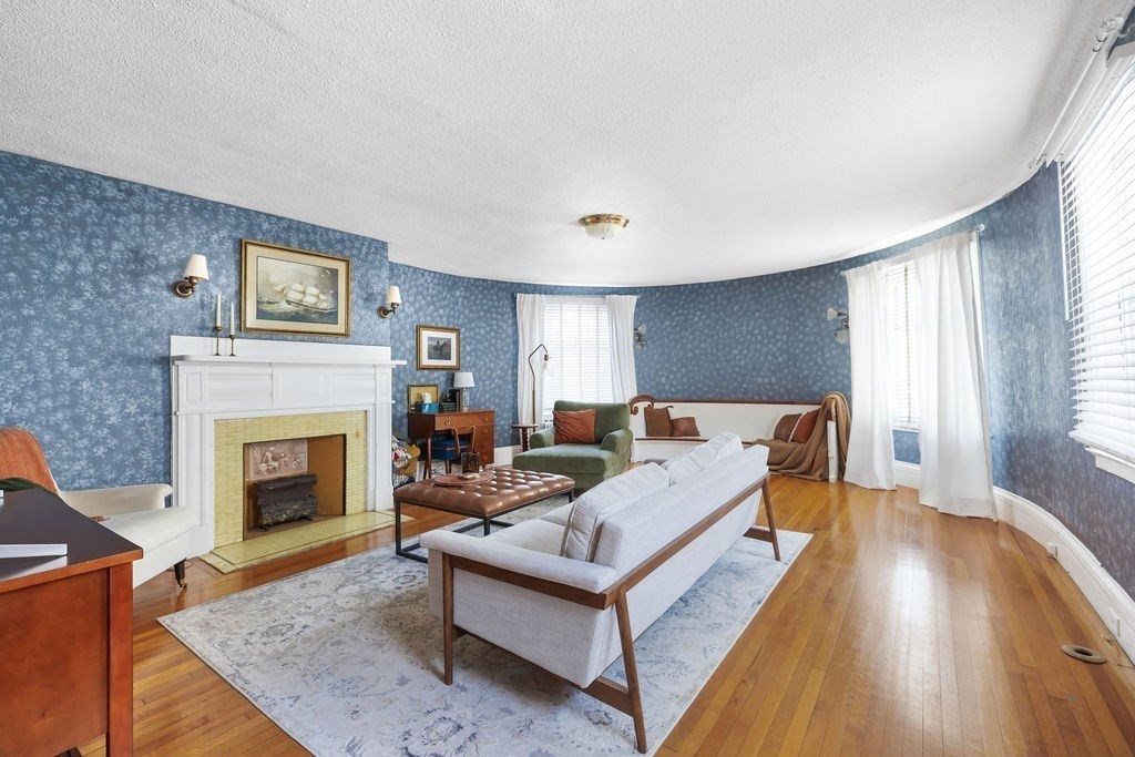 200 Washington Street Boston, MA 02135 - Photo 8 of 27 a living room with furniture and a fireplace